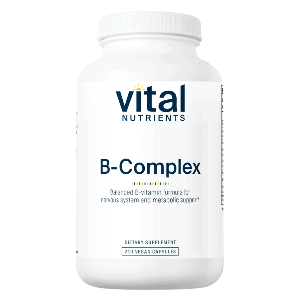 A white plastic bottle of Vital Nutrients B-Complex dietary supplement, featuring a clean white label with dark blue text and a small yellow sun icon, set against a plain white background.