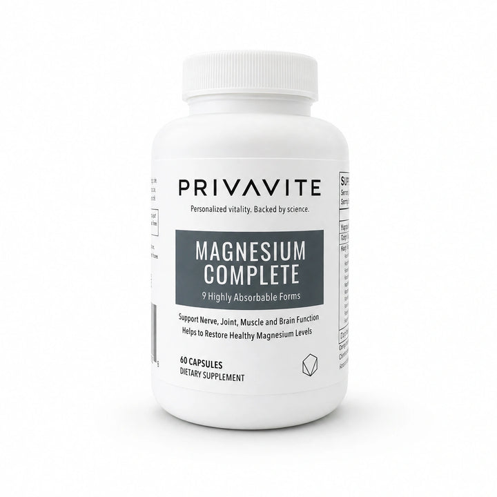 A white plastic bottle of PRIVAVITE Magnesium Complete dietary supplement with a ribbed white cap, shown on a seamless white background.